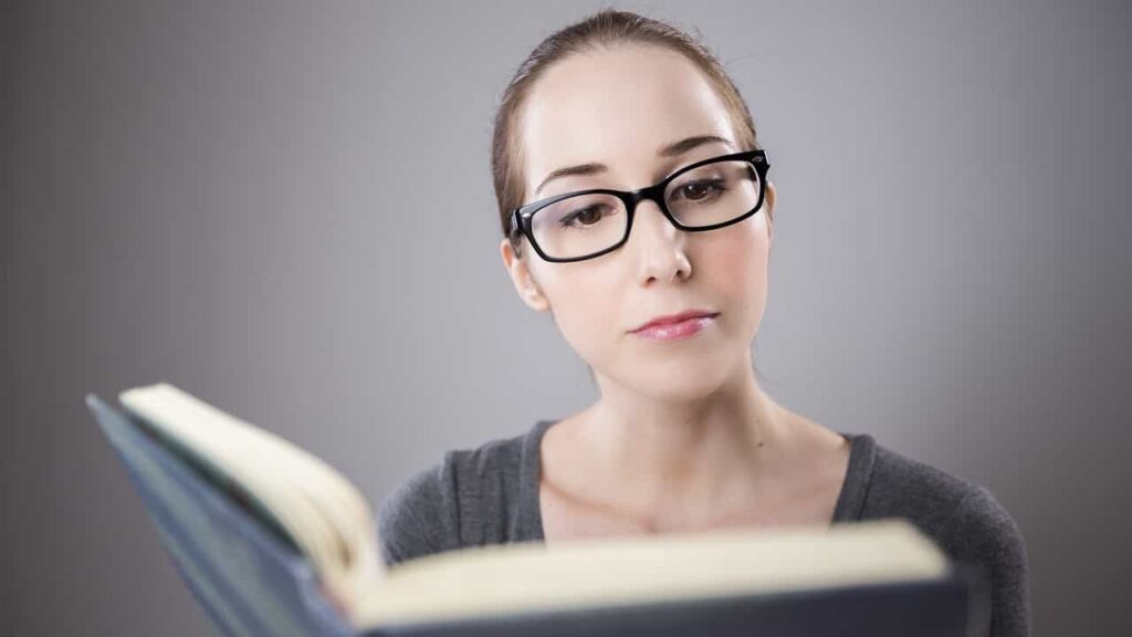 Person reading a book to illustrate an article titled "What is Content Marketing?"