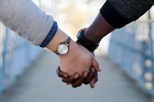 Interratial Couple Holding Hands - What Really Matters