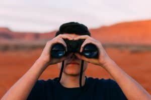 Man using binoculars.